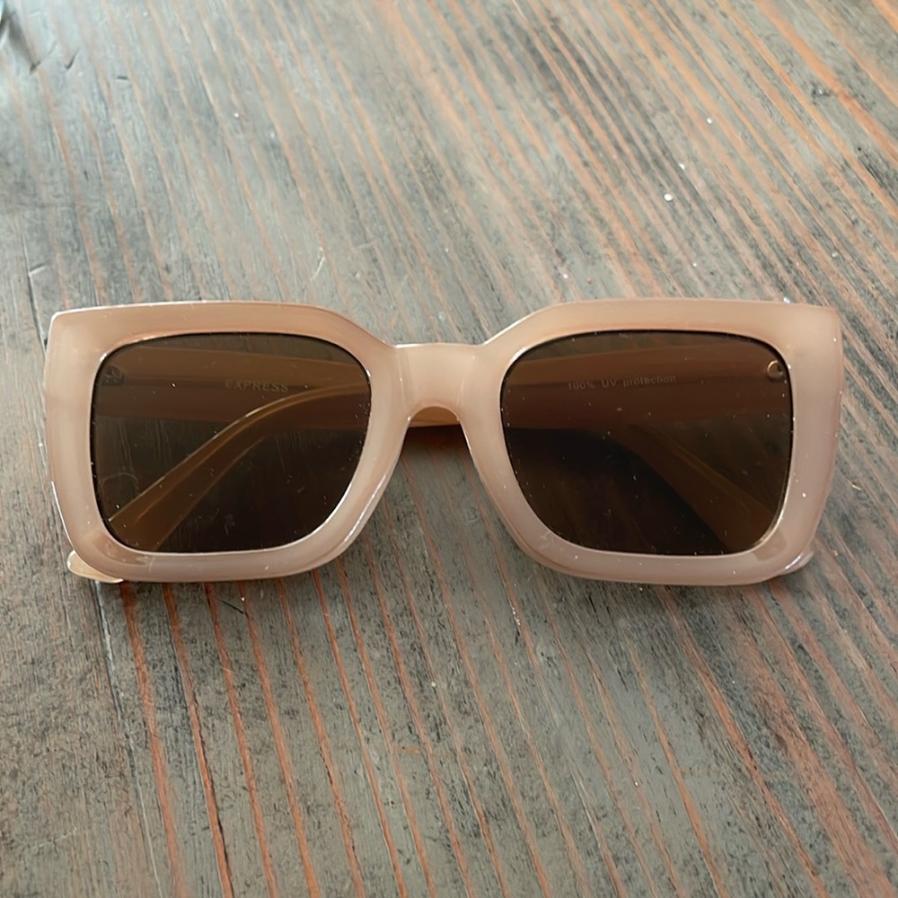 Thick framed sunglasses. Has some minor wear.